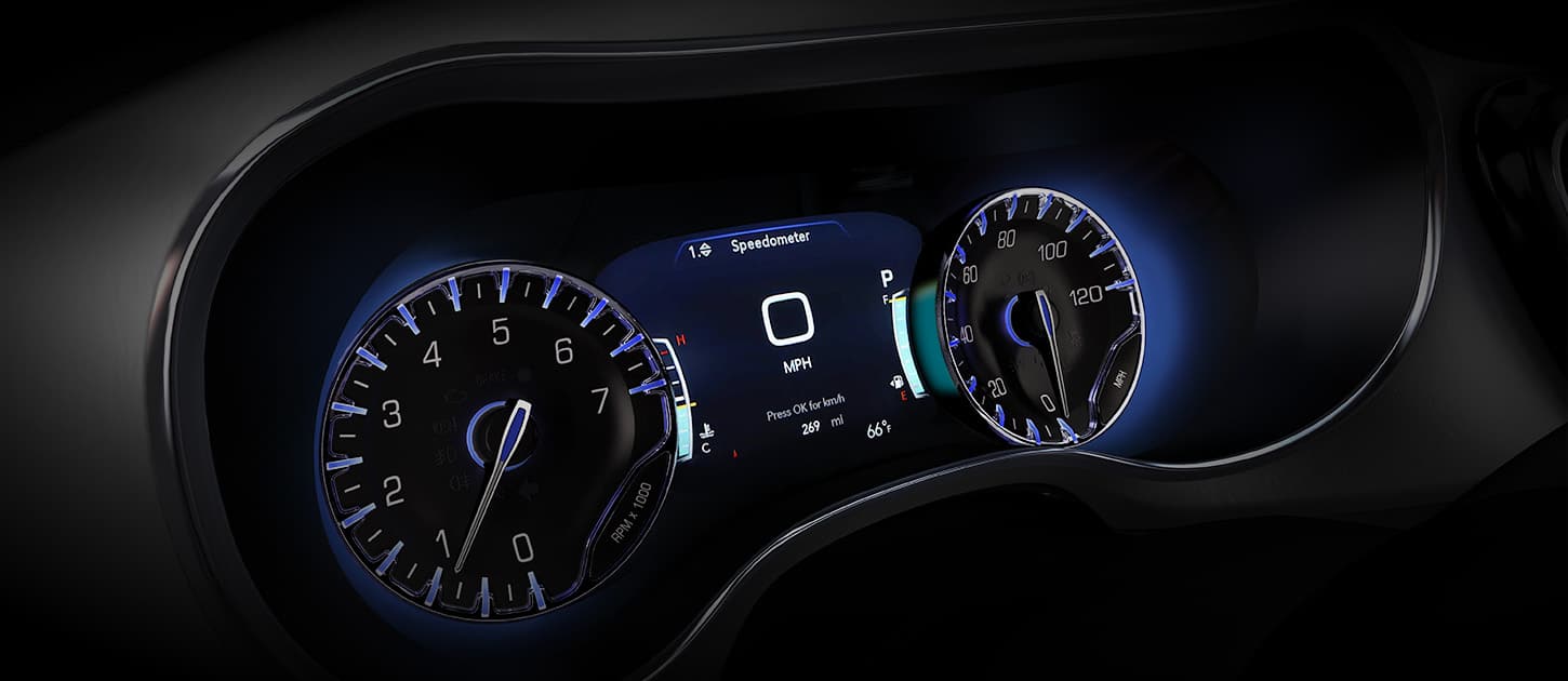 A close-up of the Digital Cluster Display in a 2025 Chrysler Voyager with gauges on the two ends.