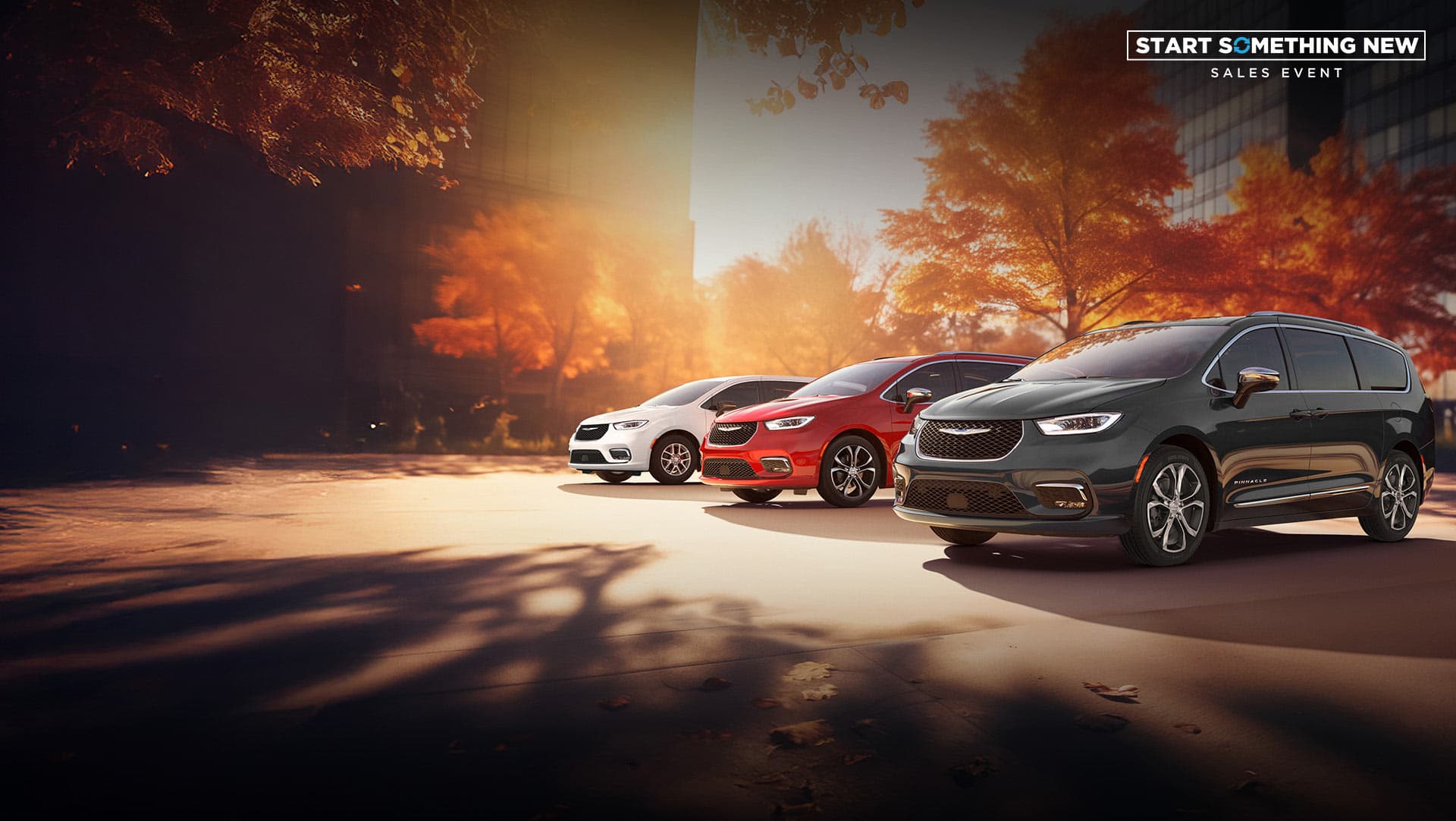 Three 2026 Chrysler minivan models parked on an oceanside beach. From left to right: a white Chrysler Voyager, a blue Pacifica Pinnacle Plug-in Hybrid and a red Pacifica Pinnacle. Start Something New Sales Event.