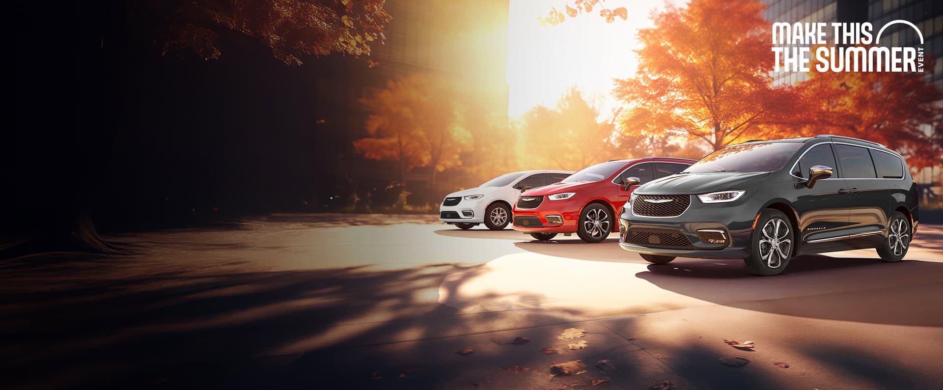 Three 2026 Chrysler minivan models parked on an oceanside beach. From left to right: a white Chrysler Voyager, a blue Pacifica Pinnacle Plug-in Hybrid and a red Pacifica Pinnacle. Make this the Summer Event.