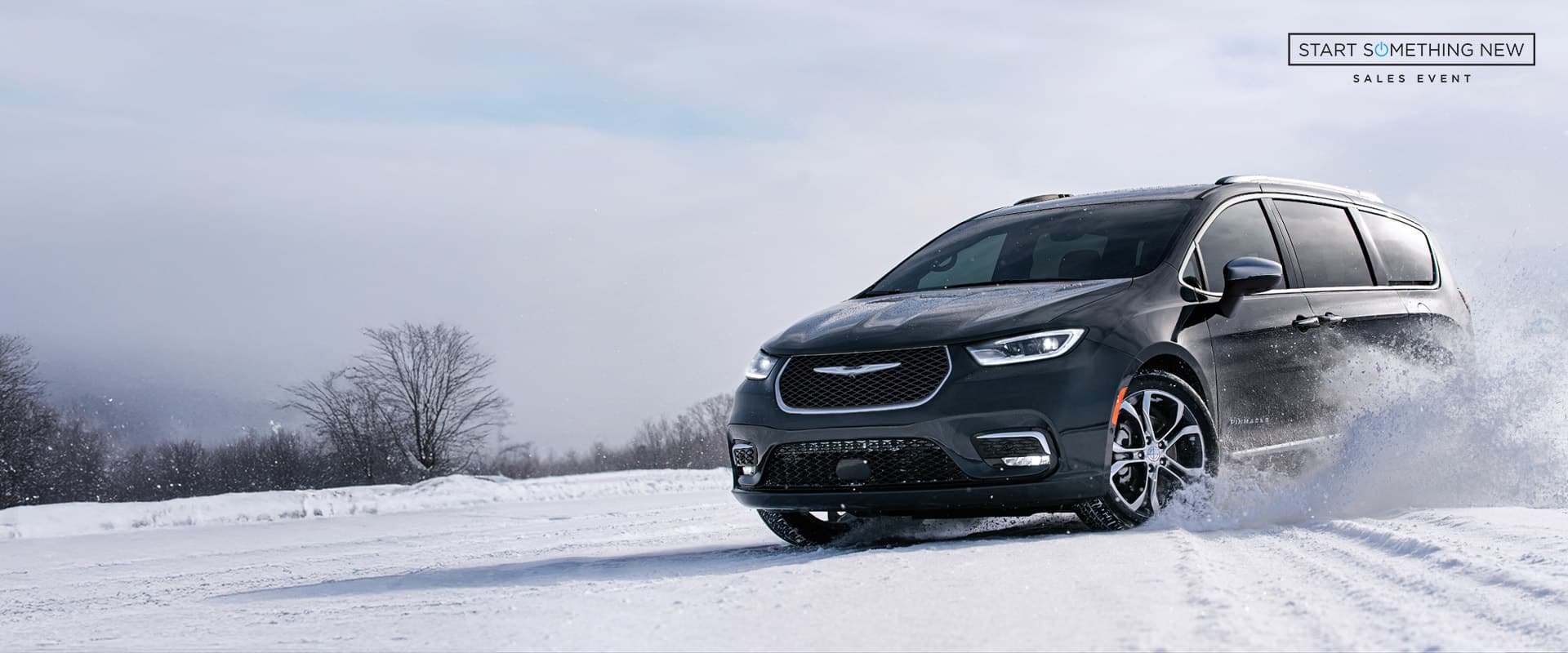 The 2024 Chrysler Pacifica Pinnacle being driven on a snow-covered surface. Start Something New sales event.