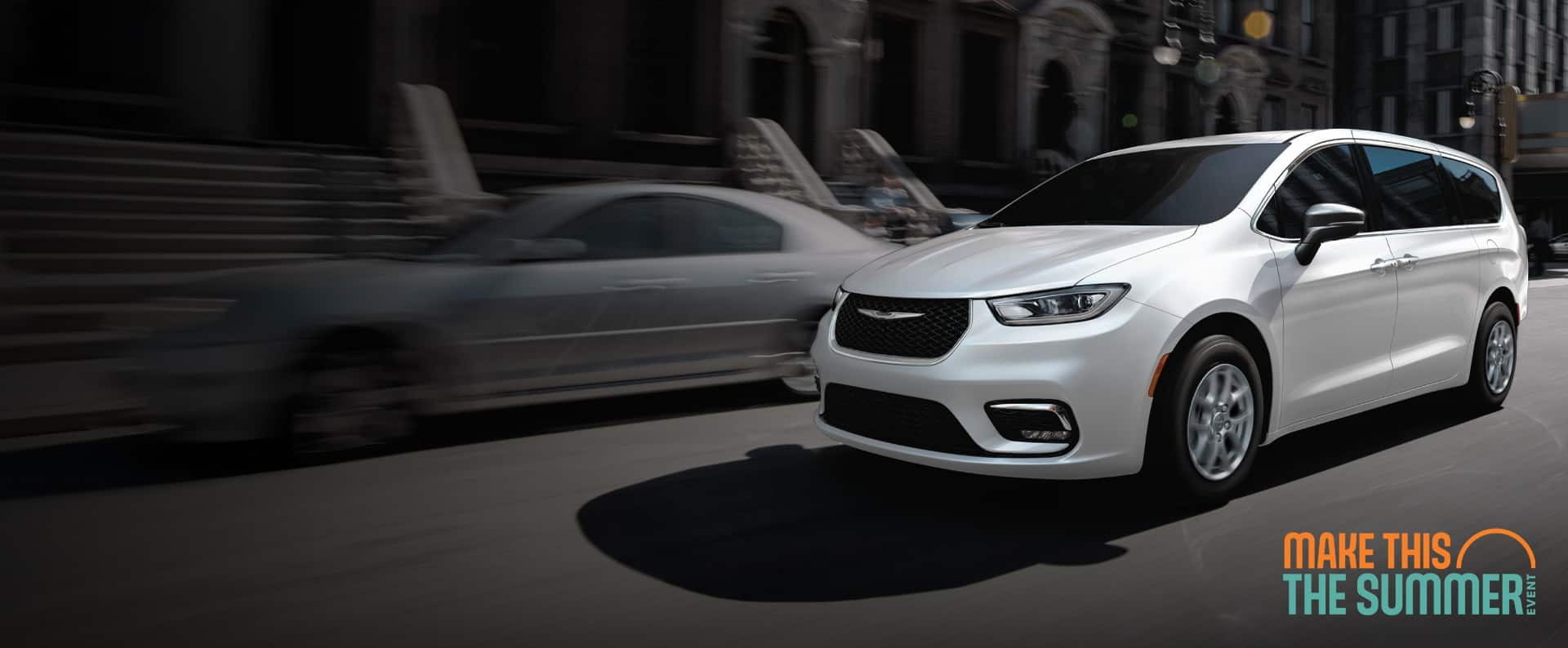 A white 2026 Chrysler Pacifica Select driving down a city street. Make this the Summer Event.