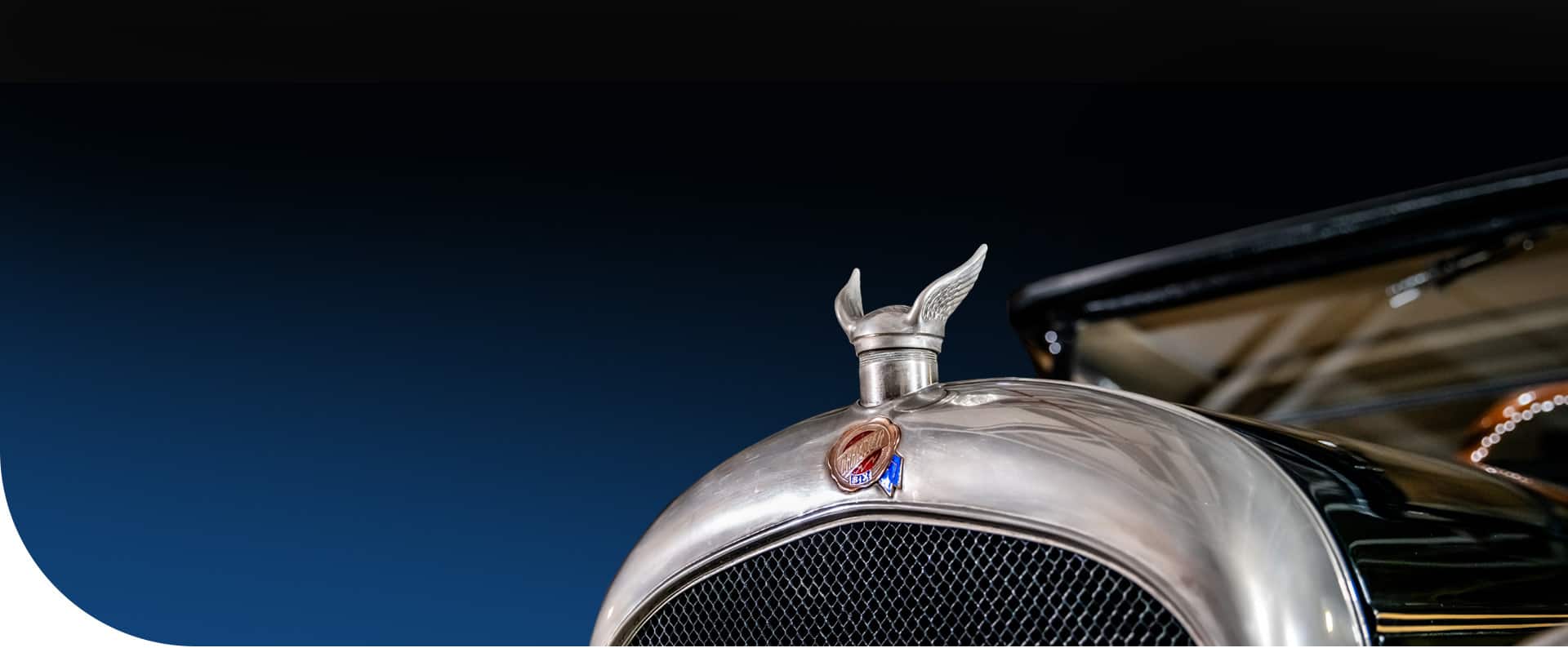 Part of the hood and grille on a vintage 1924 Chrysler Six.